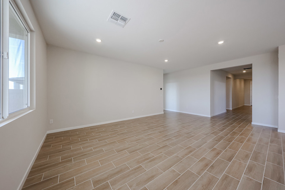 A room with a wood floor.