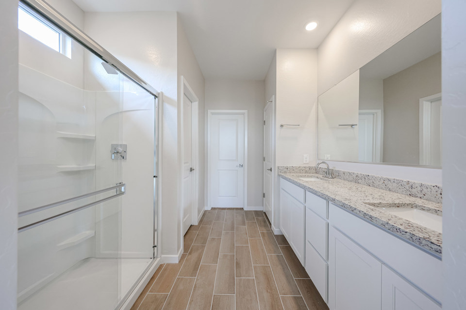 A bathroom with a glass shower.