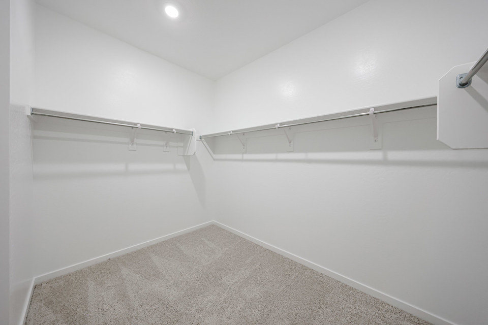 A white wall with a light on it.