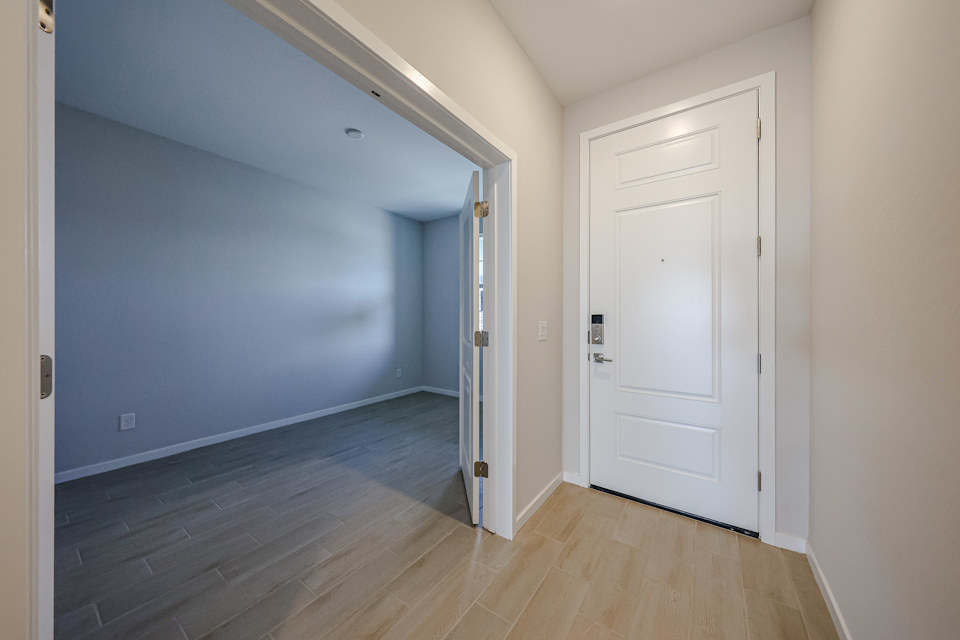A hallway with white doors.