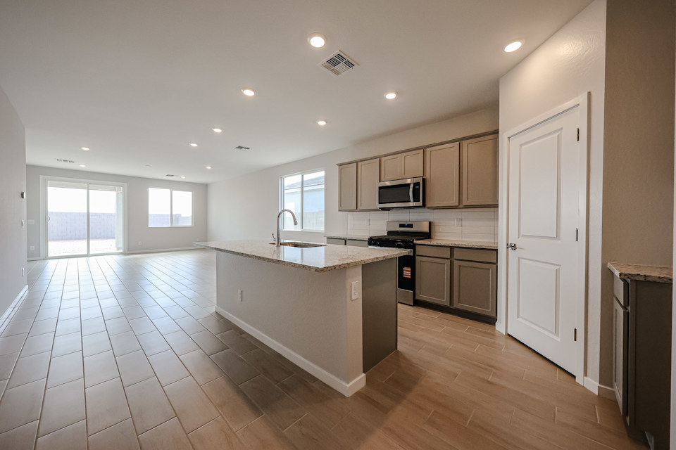 A kitchen with a large island.