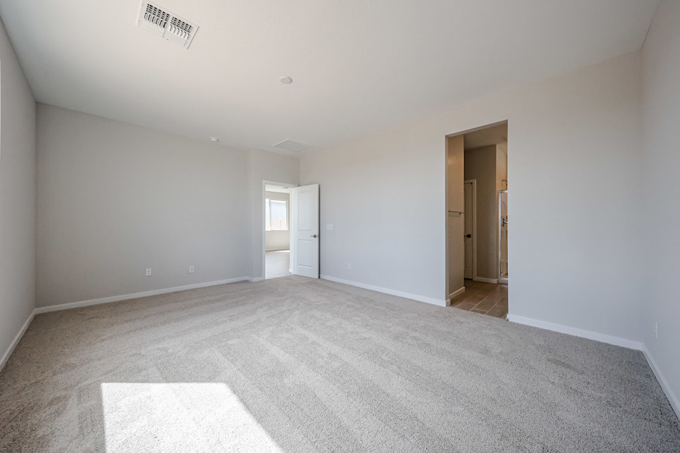 A hallway with white walls.