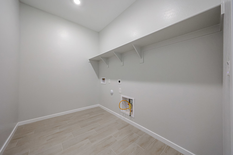 A room with a wood floor and a wood floor.