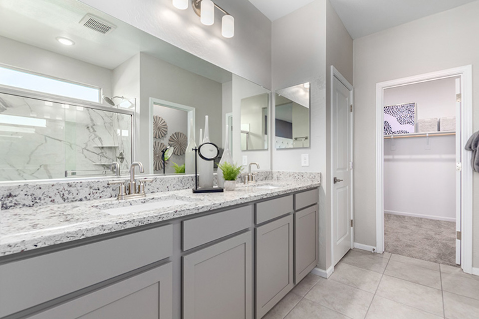 A bathroom with a marble countertop.