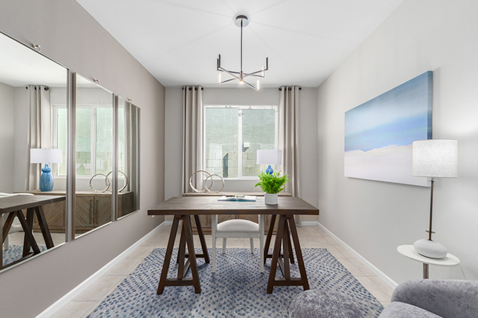 A room with a table and chairs.