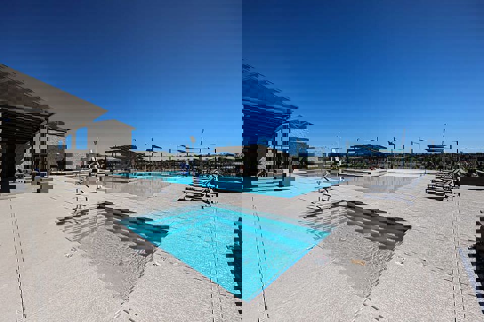 A swimming pool in a large courtyard.