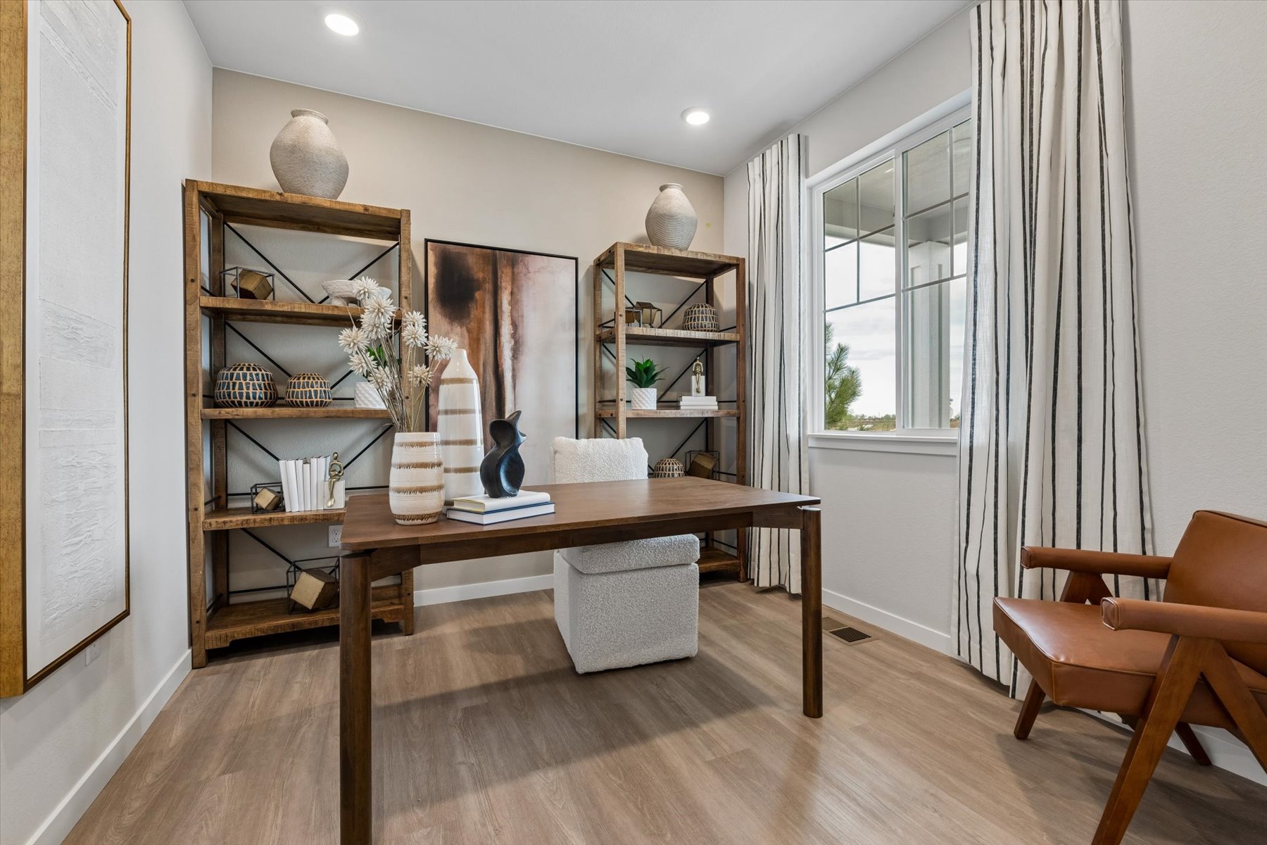 A room with a table and chairs.