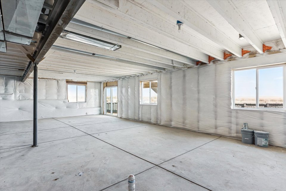 A building with windows and a pole.