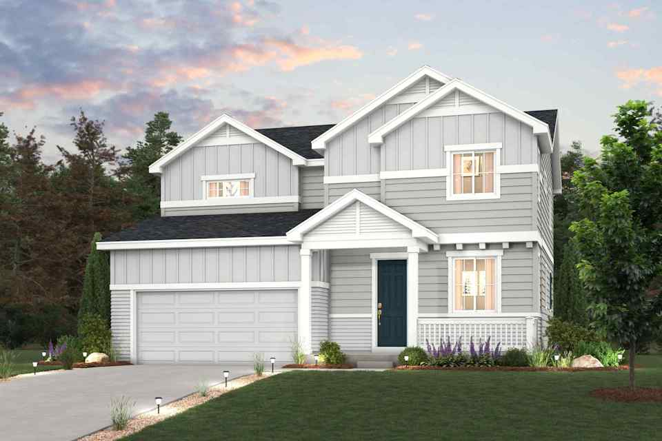 A white house with a driveway.