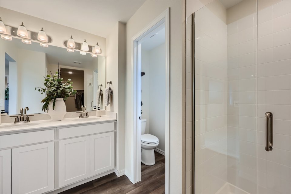 A bathroom with a glass shower.