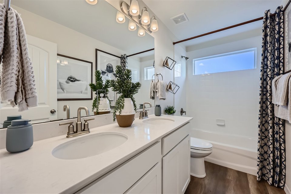 A bathroom with a large mirror.