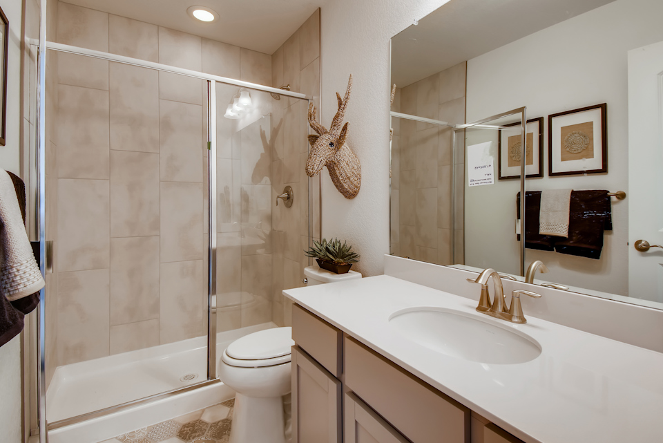 A bathroom with a glass shower.