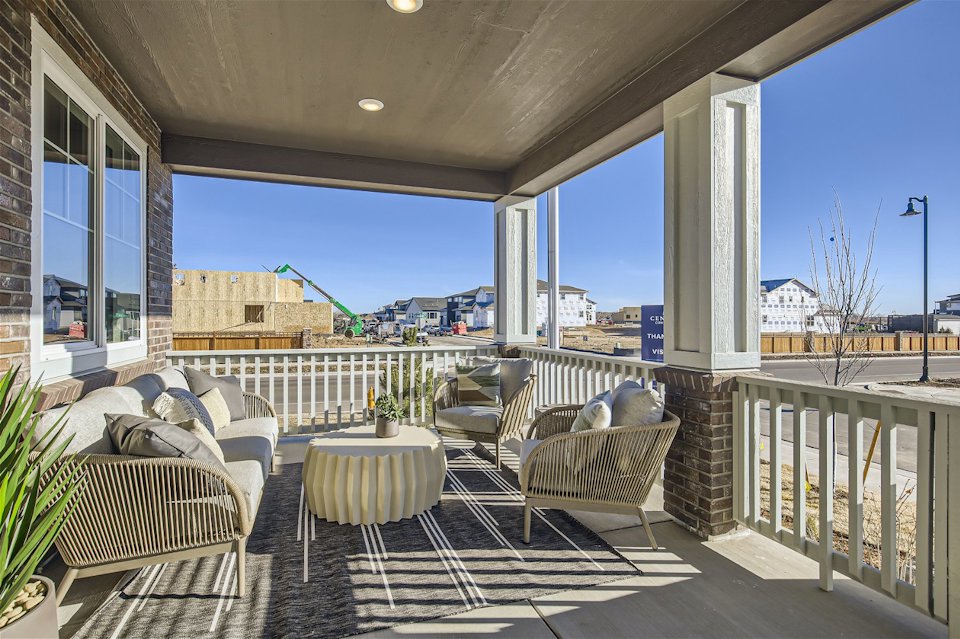 A patio with a table and chairs.