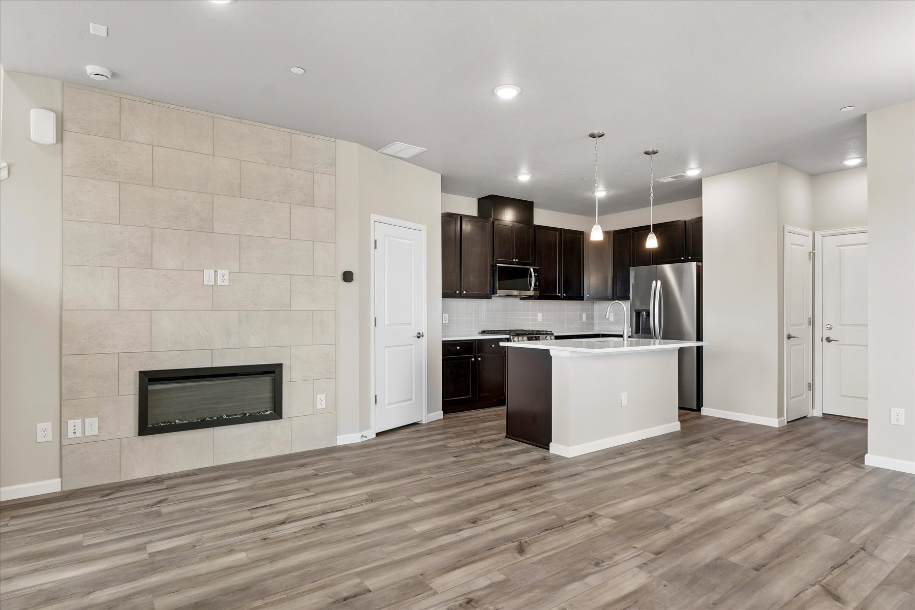 A kitchen with wooden floors.