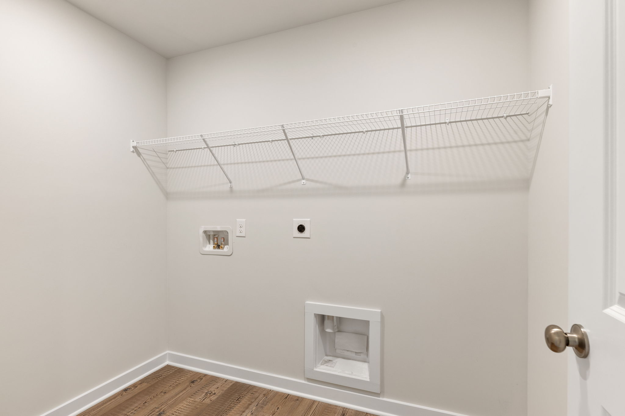 A white wall with a vent.