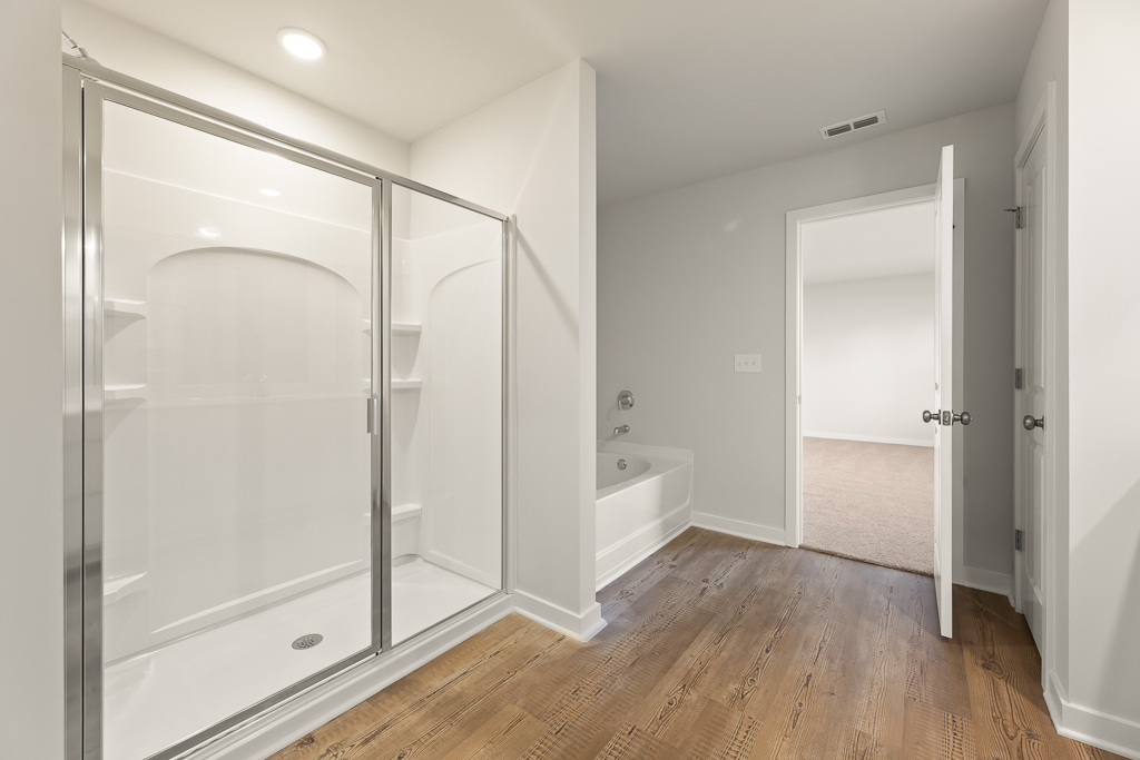 A bathroom with a glass shower.