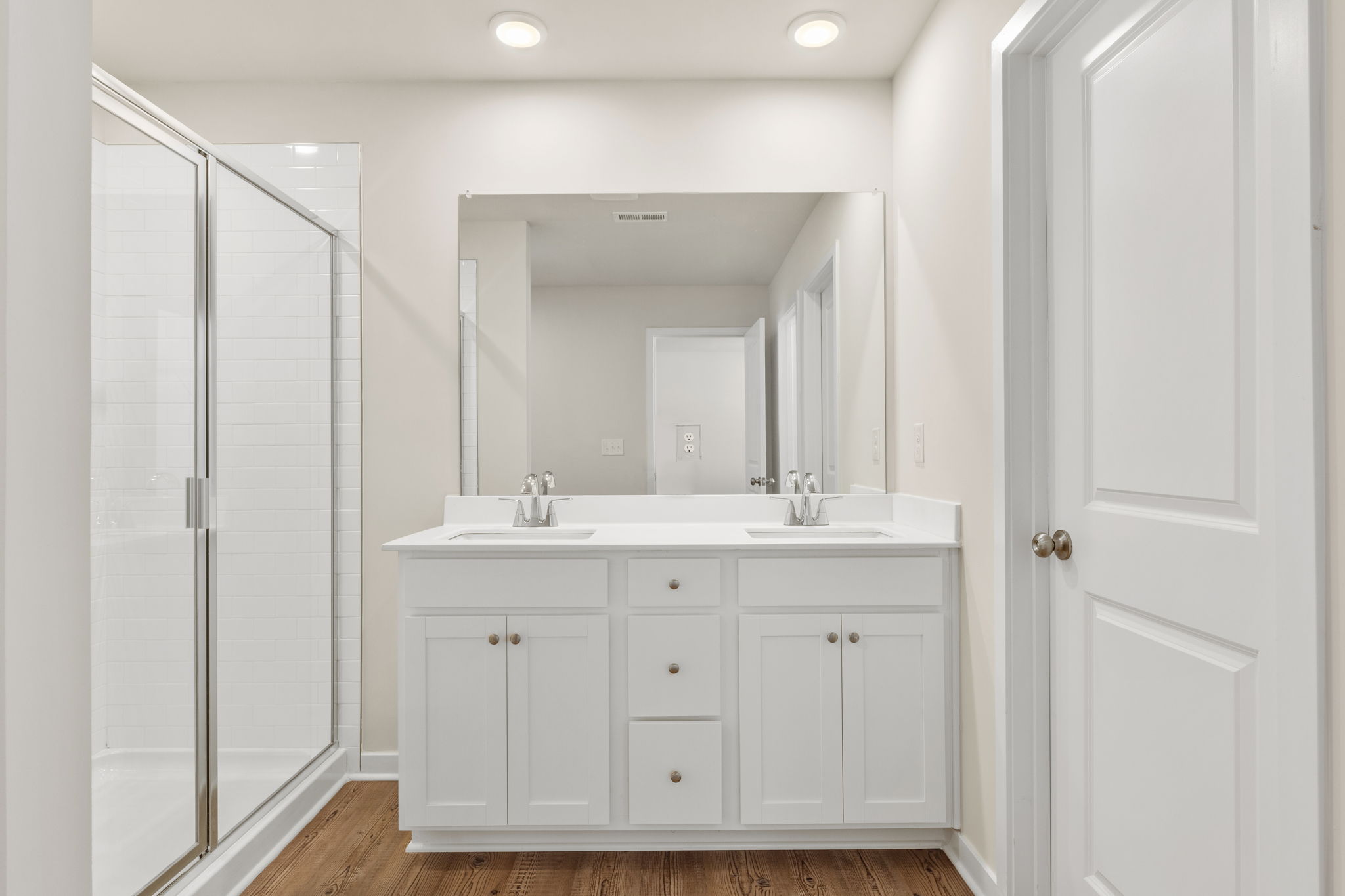 A bathroom with a sink and shower.