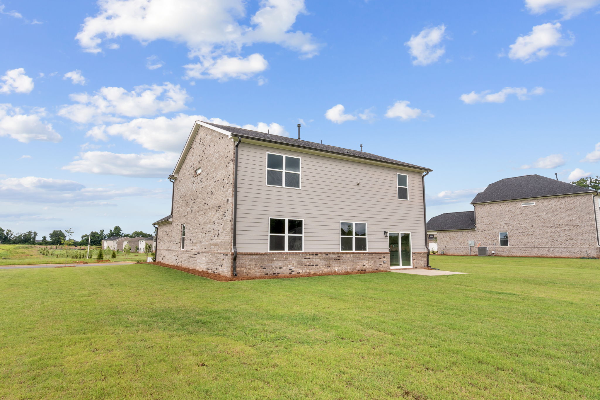 A building in a grassy field.
