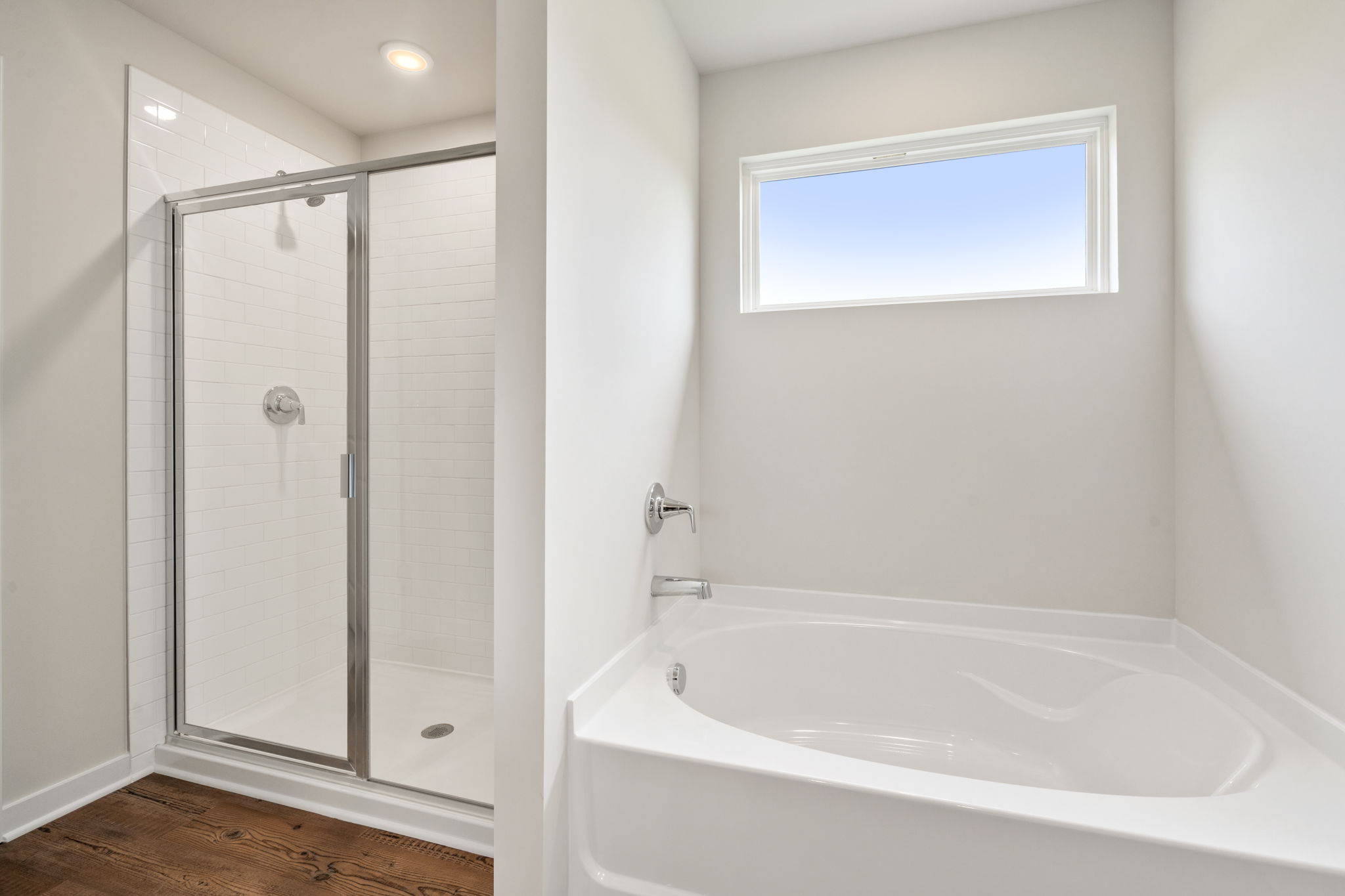A bathroom with a glass shower.
