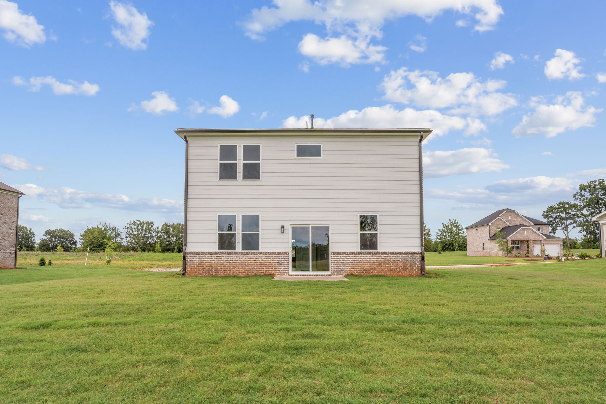 A house in a grassy field.