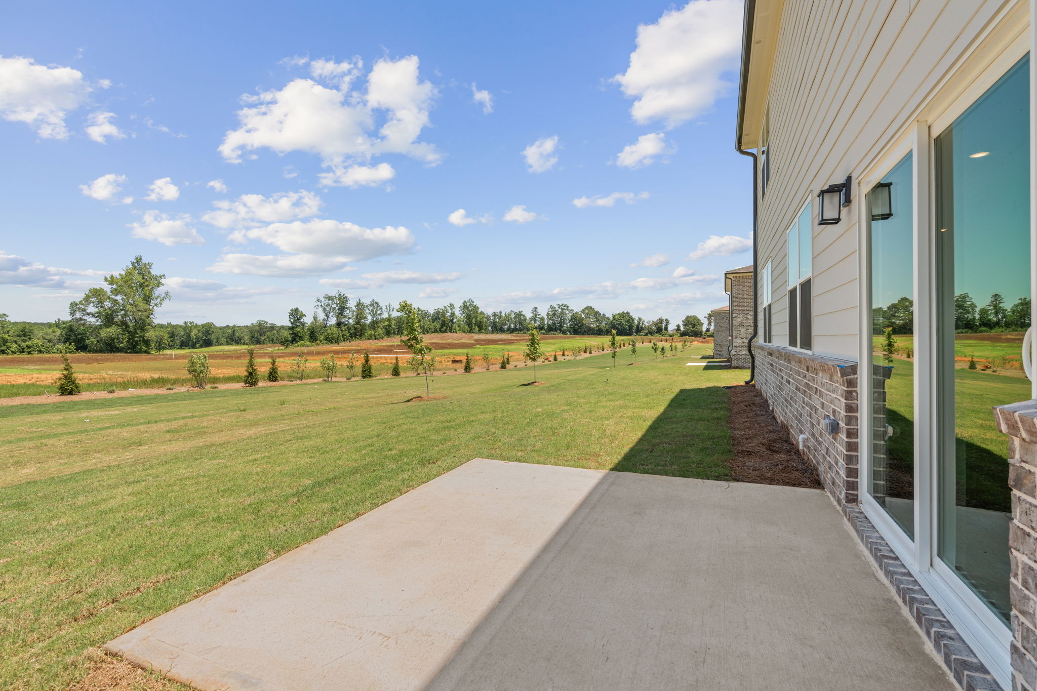 A building with a grass lawn.