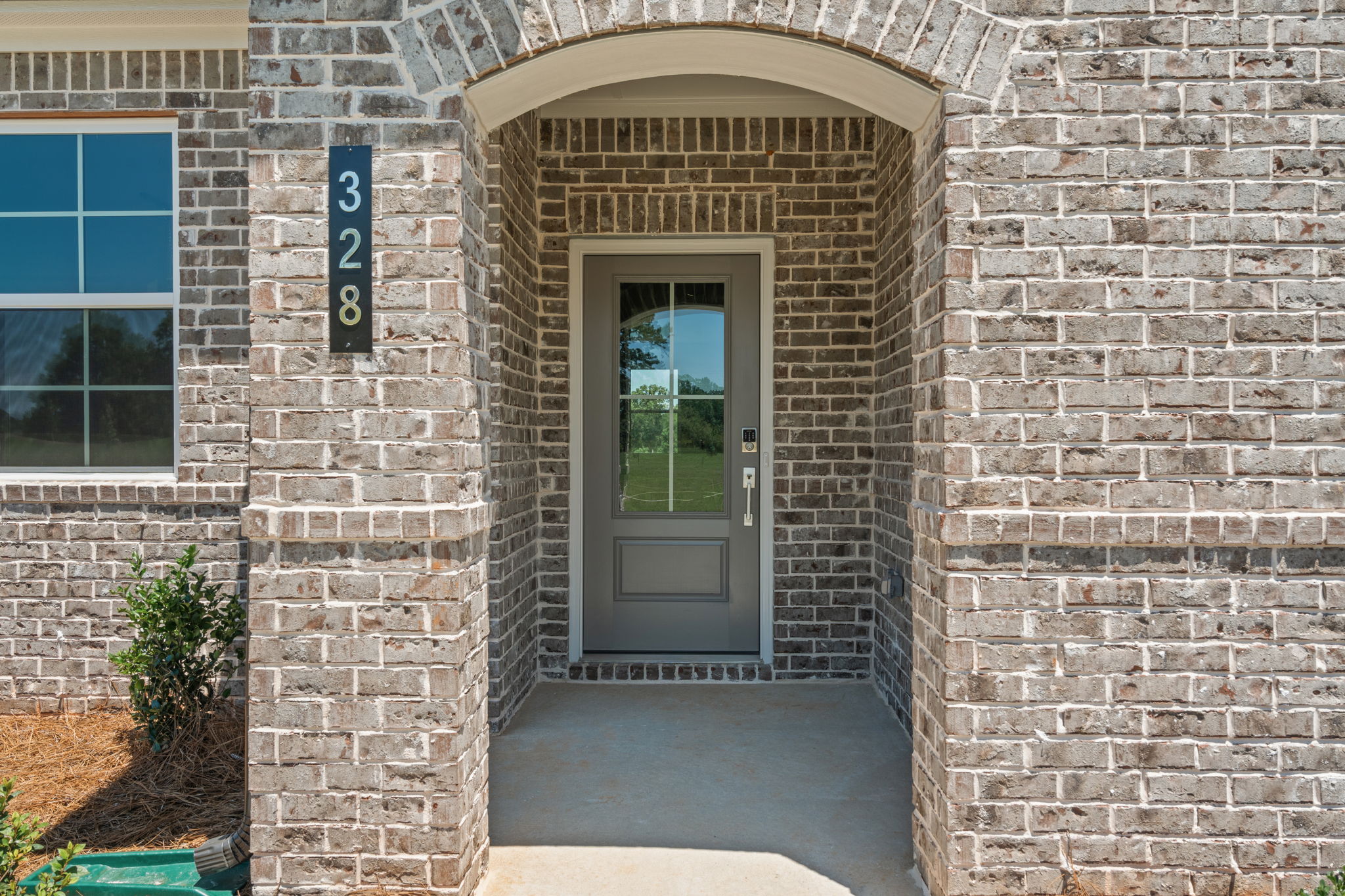 A brick building with a door.