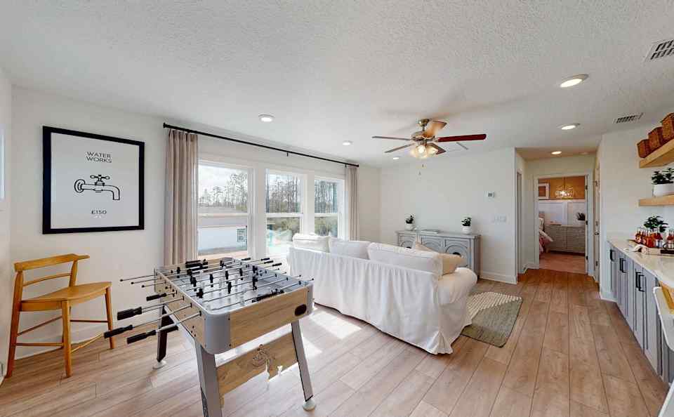 A room with a bed and a table.