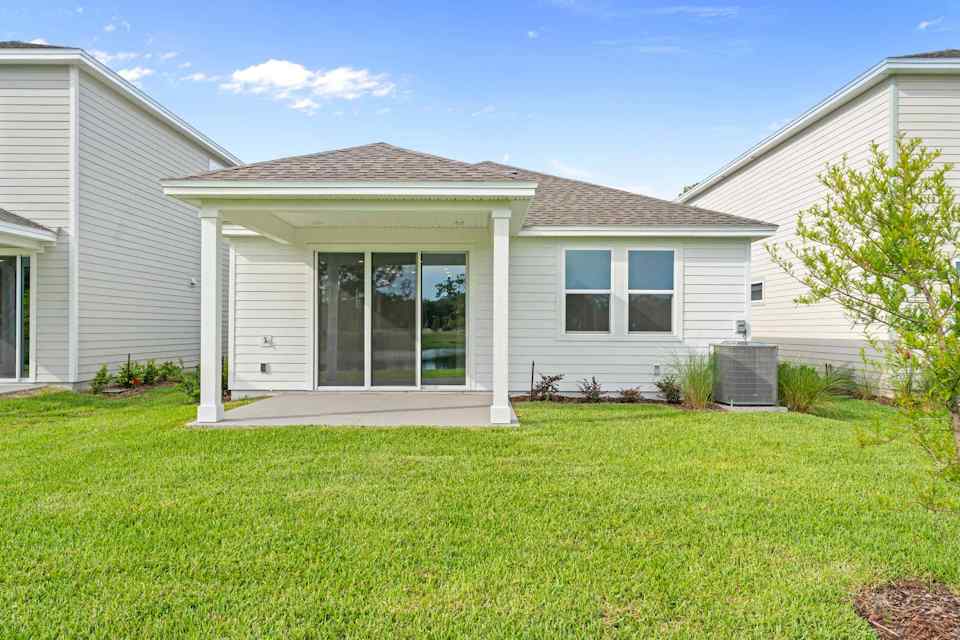 Miramar Floorplan Lot 81 Backyard with Covered Patio at Concourse Crossing in Fernandina Beach