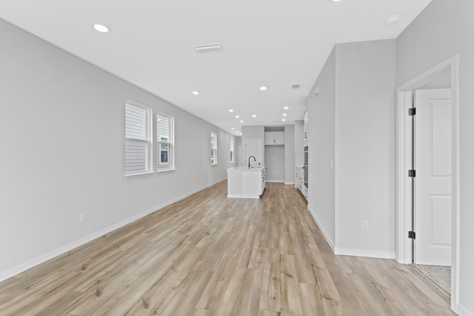 Miramar Floorplan Lot 81 Living Room area overlooking Kitchen at Concourse Crossing in Fernandina Beach