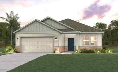 A house with a garage and a lawn in front of it.