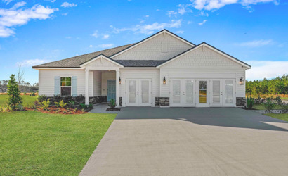 A white house with a driveway.