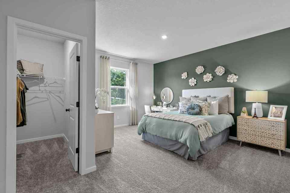 A bedroom with a large bed.