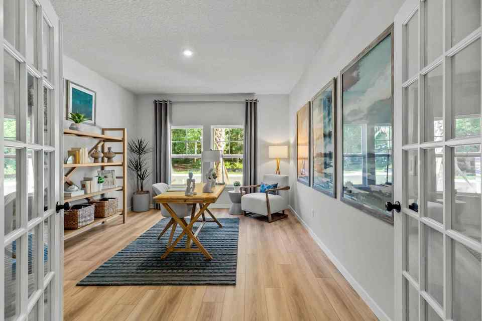 A room with a table and shelves.