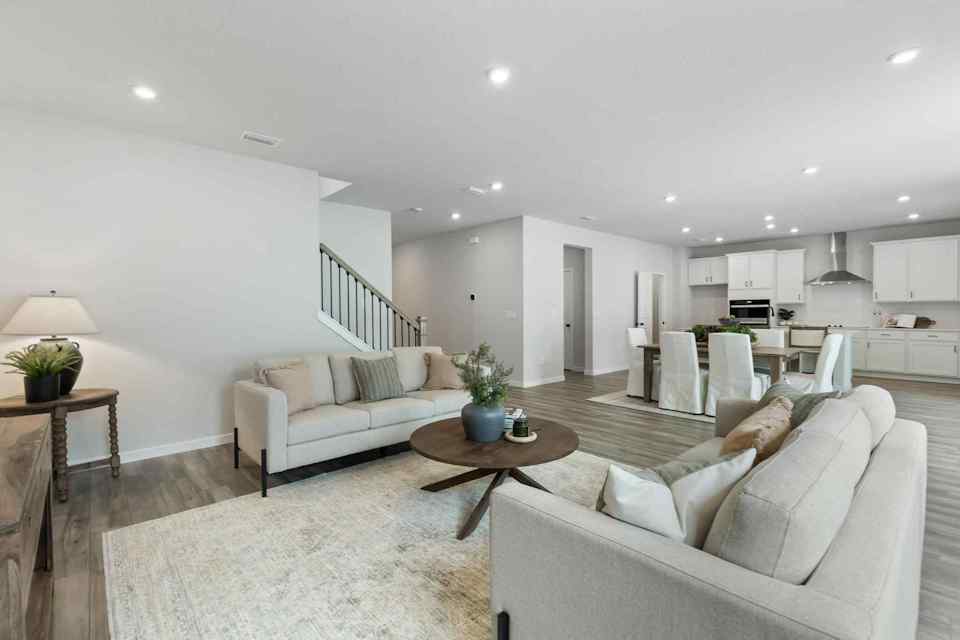 A large living room with a couch and a coffee table.