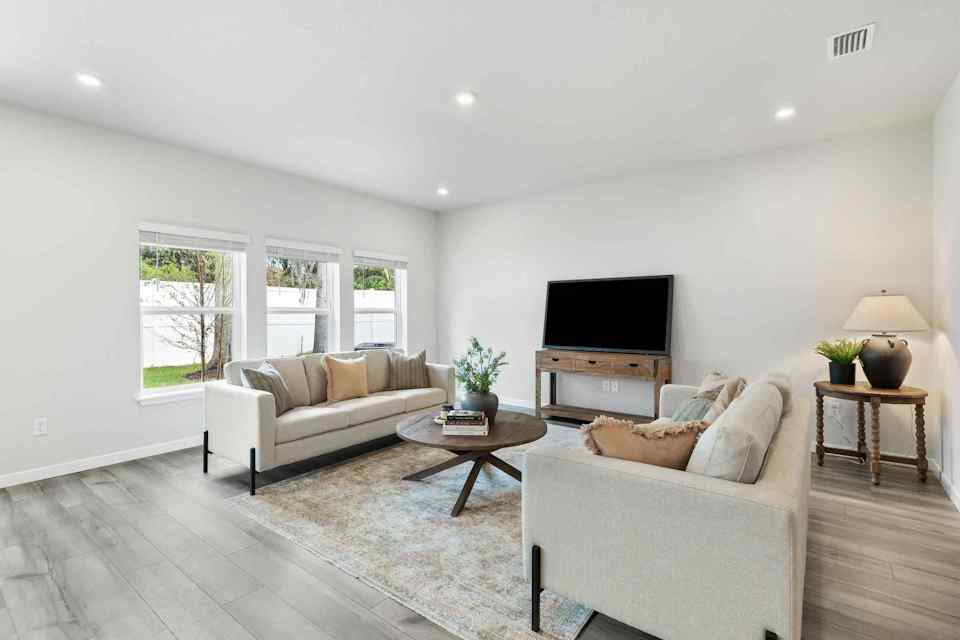 A living room with a tv and couches.