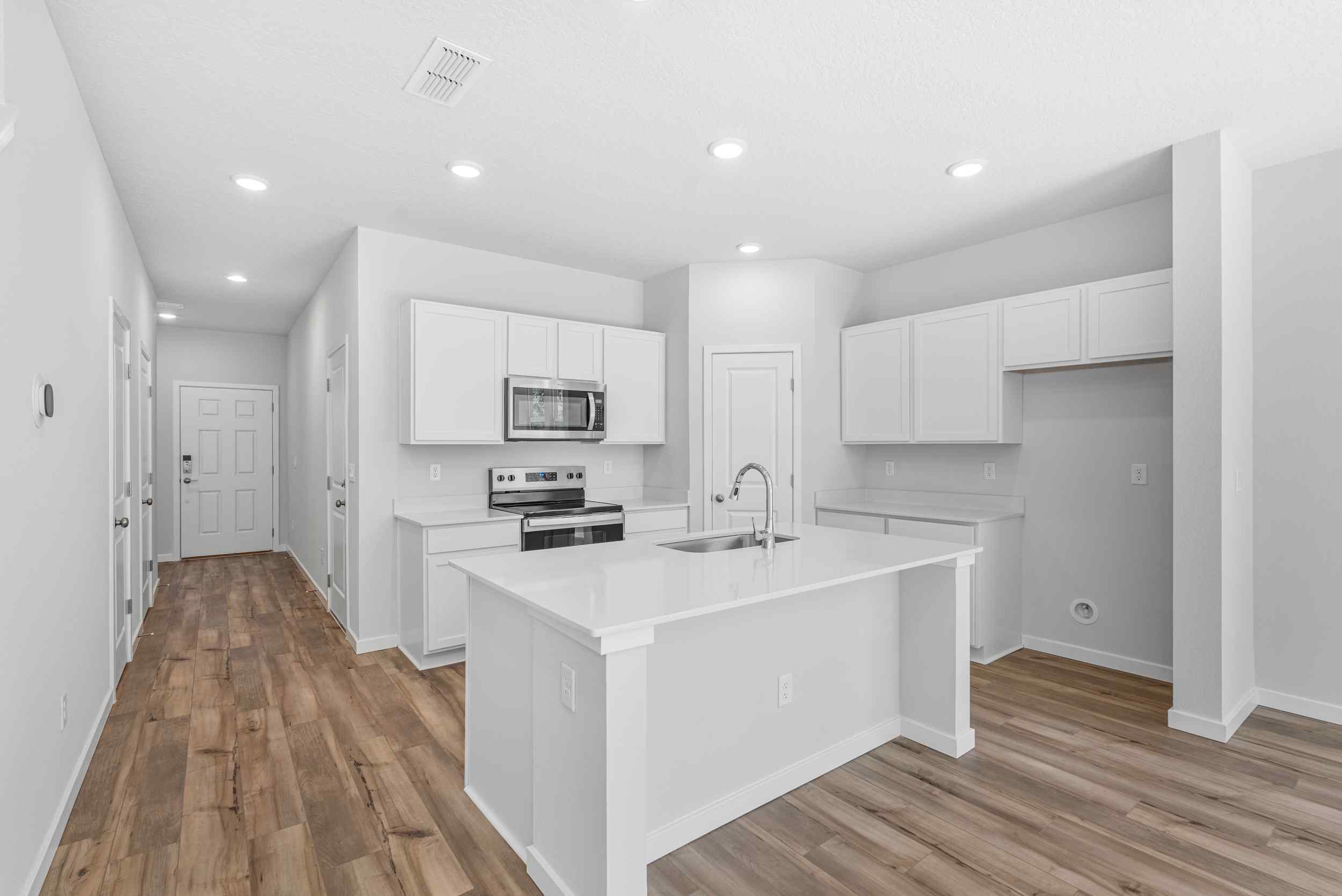Davor Paired Home Kitchen with Island at The Landings at Pecan Park in Jacksonville