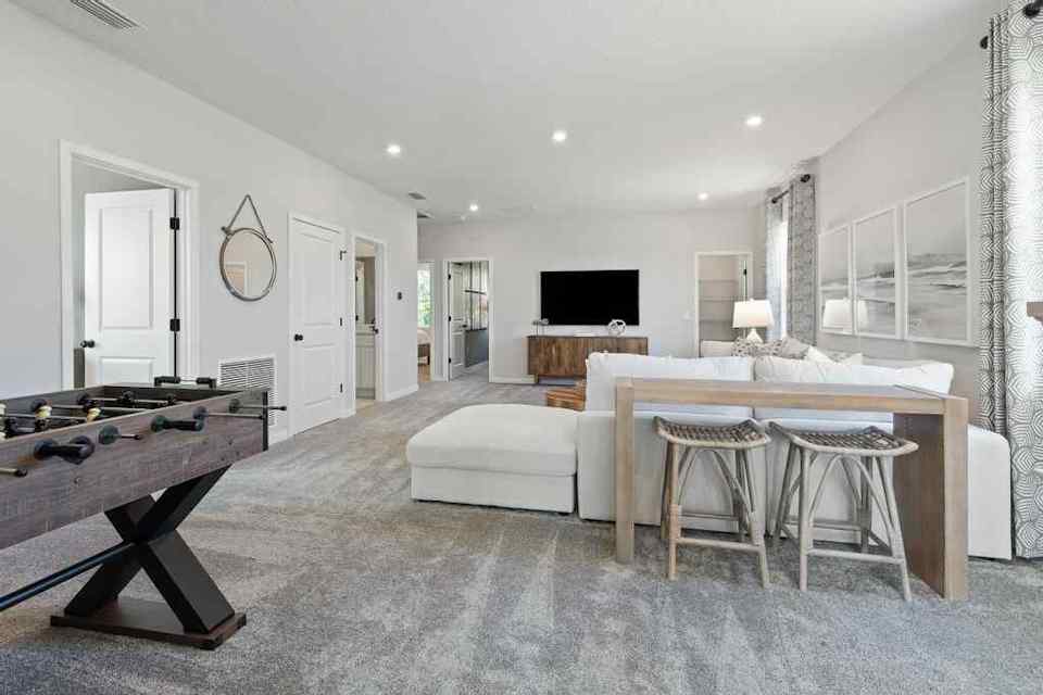 A large room with a bed and a couch.