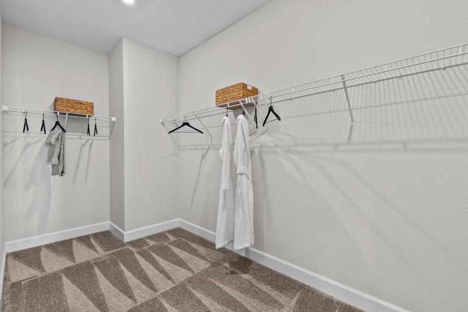 A bathroom with a bathtub and a towel rack.