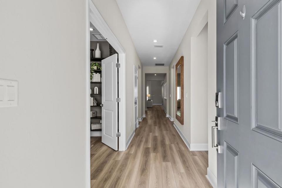 A hallway with white walls.