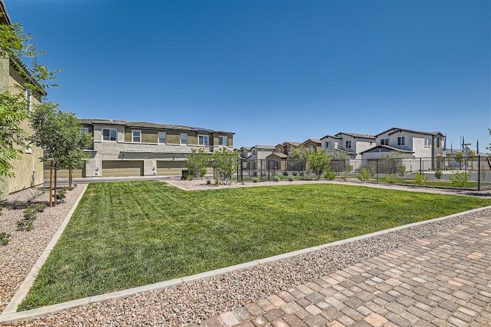 A brick path leading to a building.