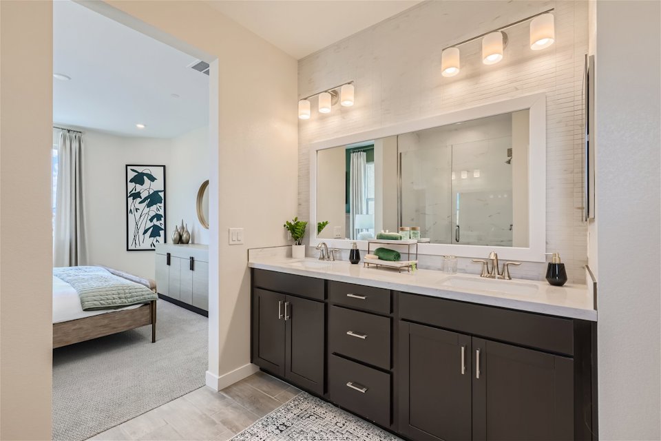 A bathroom with a large mirror.