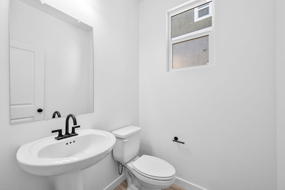 A bathroom with a sink and toilet.