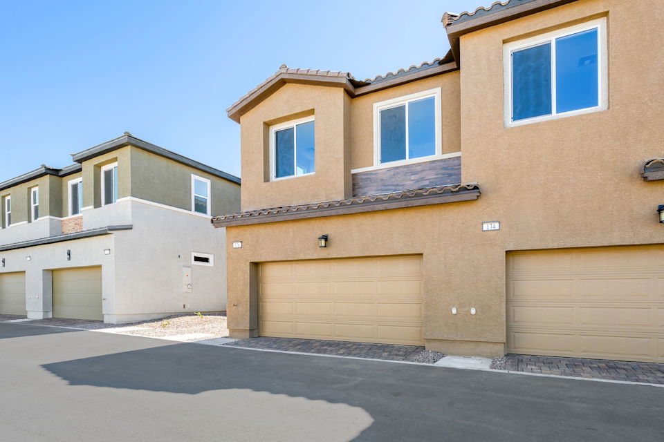 A building with garages and a blue sky.