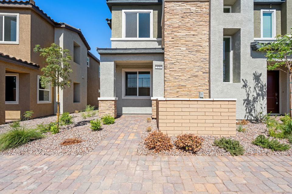 A brick building with a brick walkway.