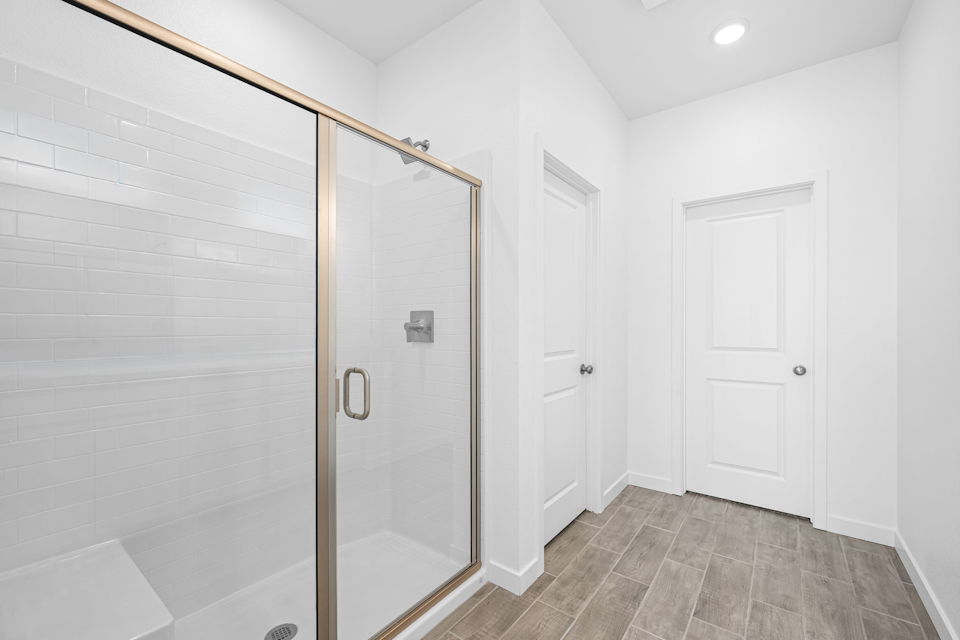 A bathroom with a glass shower.