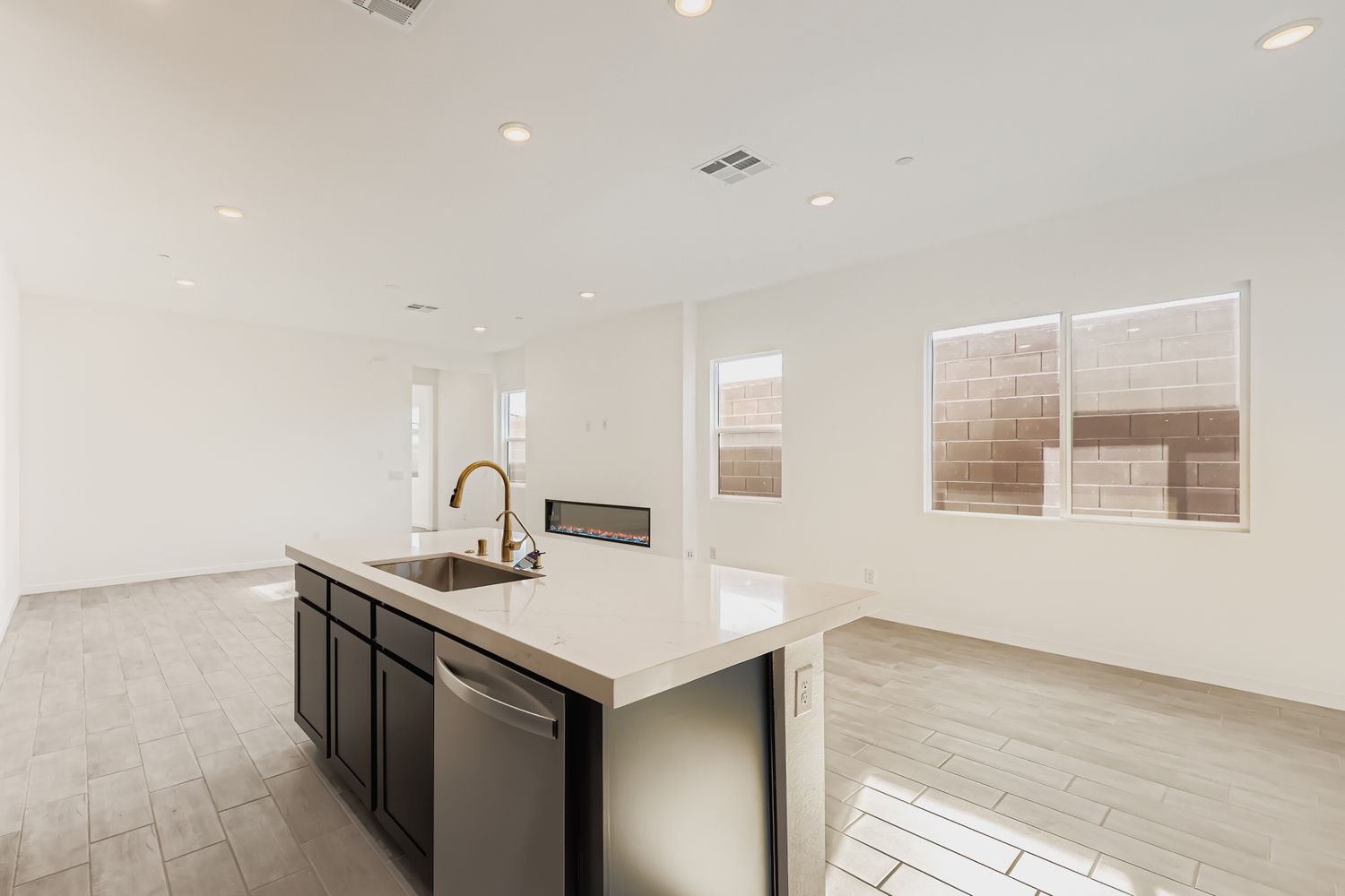 A kitchen with a sink and a counter top.