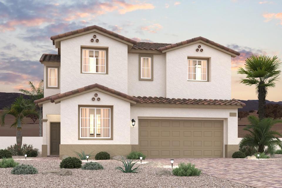 A house with a garage and palm trees.