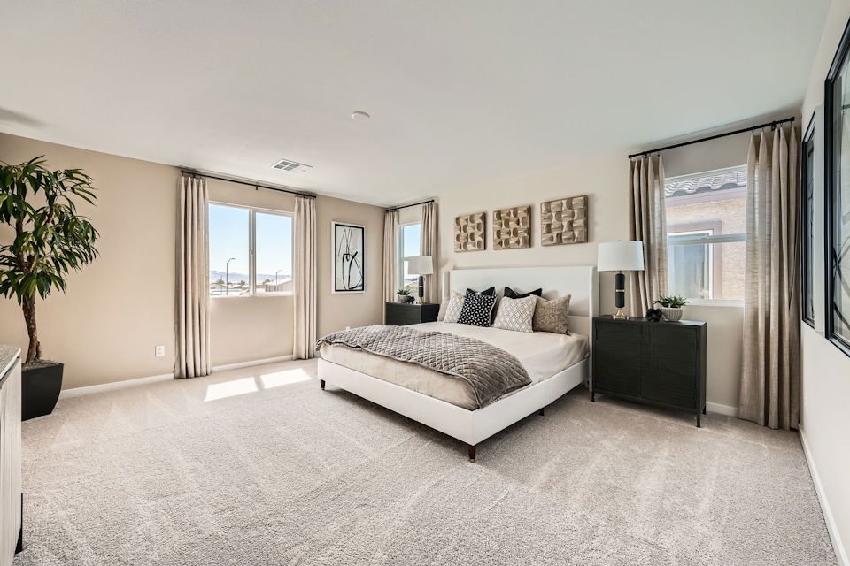 A bedroom with a large bed.