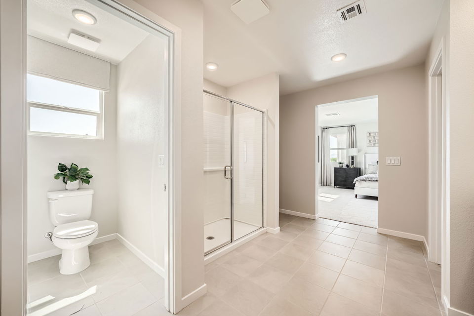 A bathroom with a glass shower.