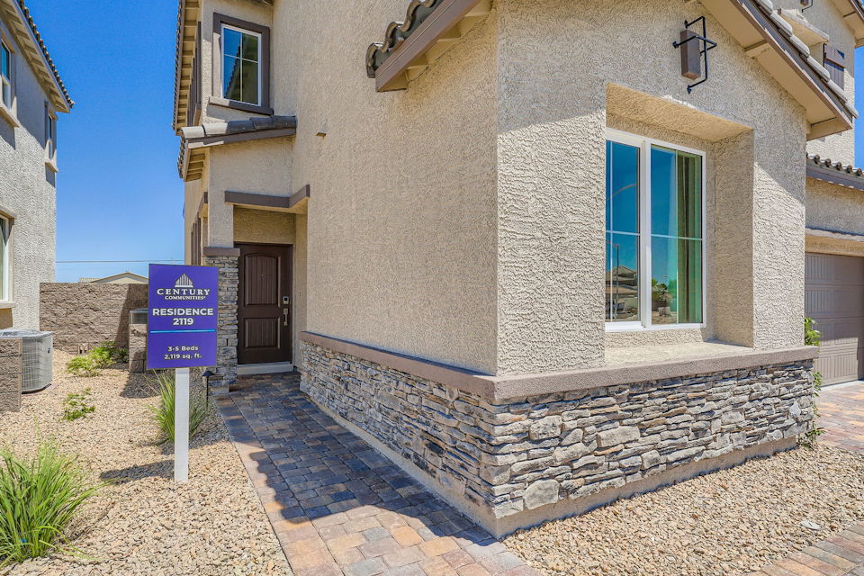 A building with a sign in front.